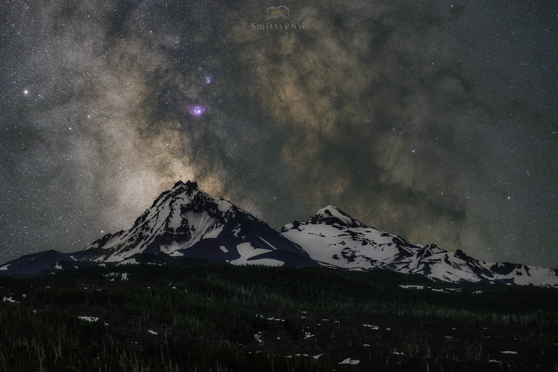 Milky Way rising above snow-covered Pacific Northwest peaks